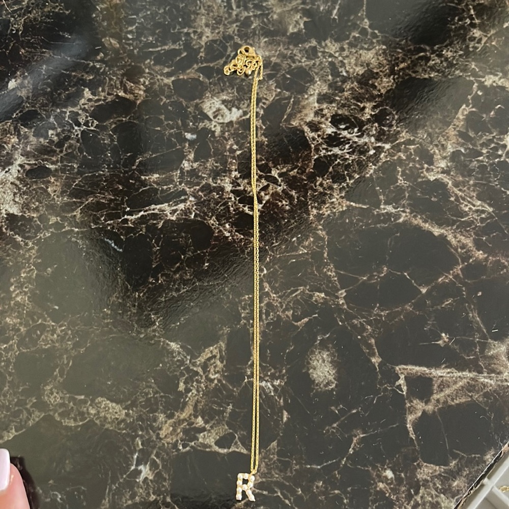 Gold pearl with an initial R necklace